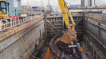 Port dismantles 1950's timber boat