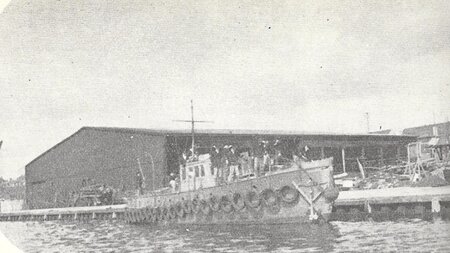 Converted fishing boat with array of rubber tyres.