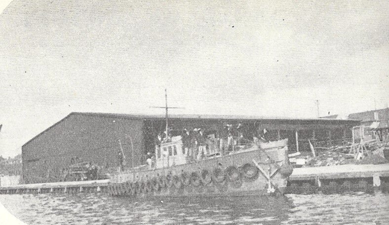 Converted fishing boat with array of rubber tyres.