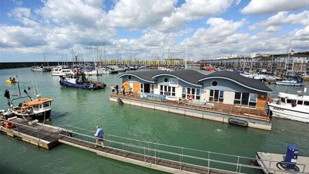 Shoreham Port tug adurni tows new million pound club house for Brighton marina